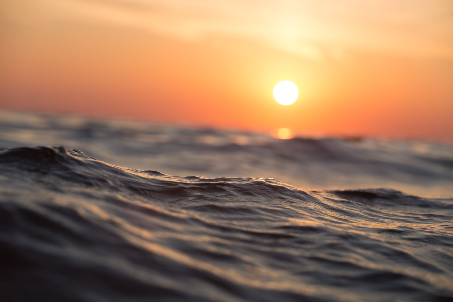 Beautiful beach with ocean waves fading into the horizon
